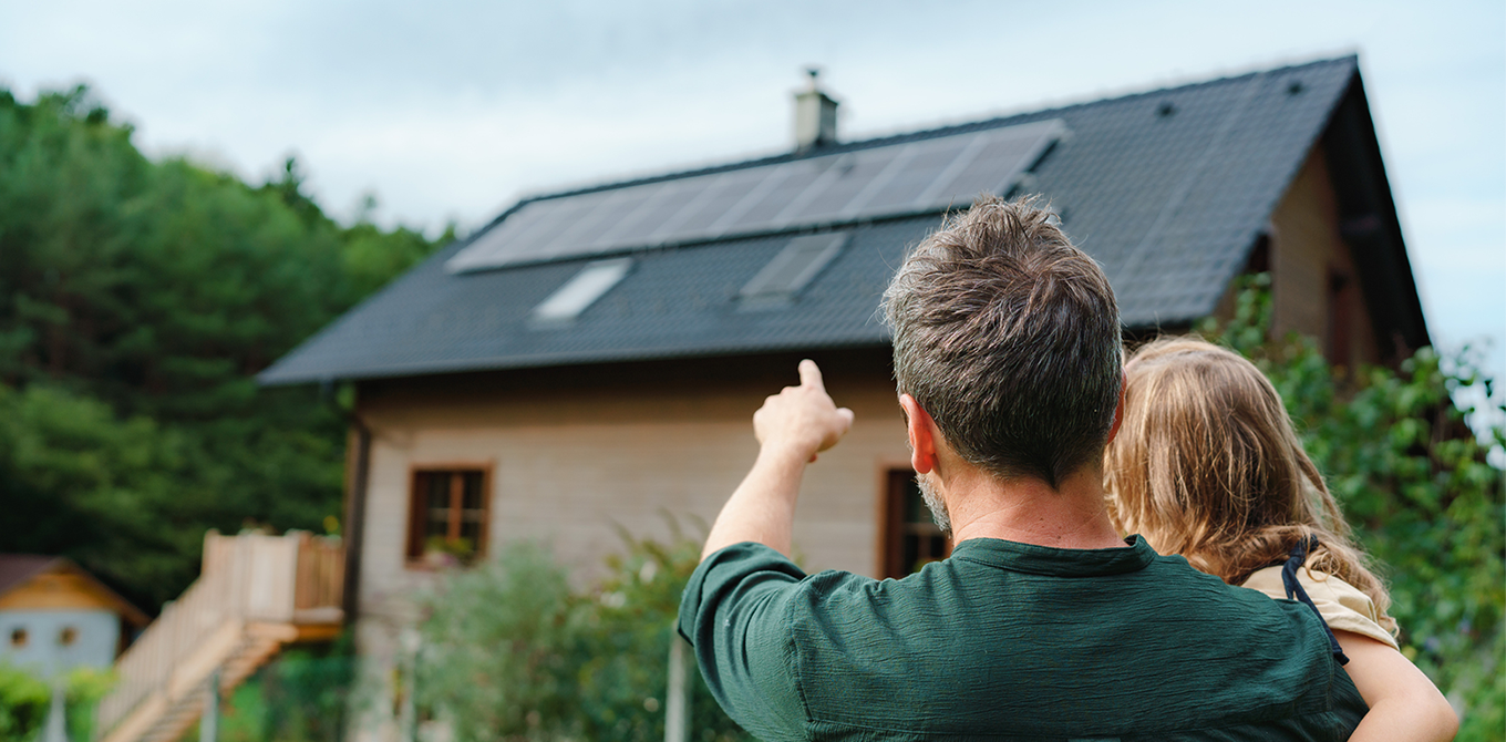 dad and daughter looking at solar panels